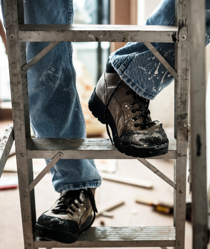 Maintenance engineer and cleaning team working in an office lobby
